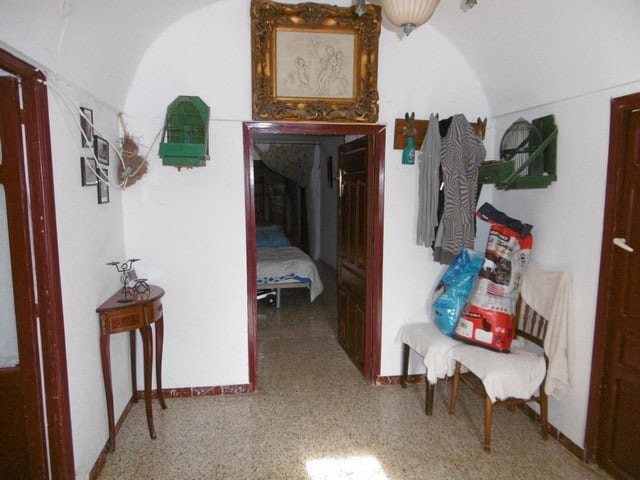 Unique cave house interior in El Margen, Granada, showcasing traditional decor and cozy living space.