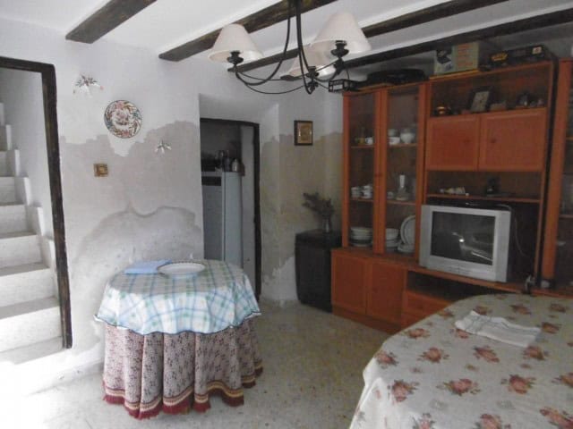 Cozy interior of a rural home in Don Pedro, Jaen, featuring traditional decor and rustic furnishings.