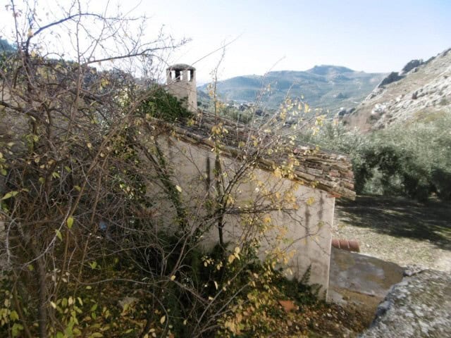 Charming rural property with traditional architecture in Don Pedro, Jaen, surrounded by scenic hills.