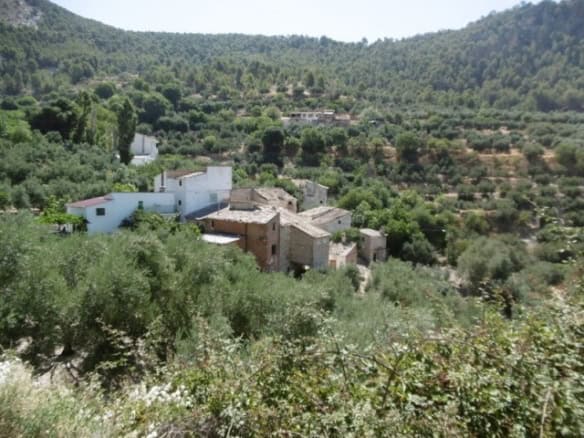 Rural property in Don Pedro, Jaen, surrounded by lush greenery and scenic hills. Ideal for countrysi.