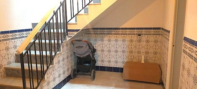 Interior view of a town house in Purchena, Almeria, showing staircase and tiled walls.