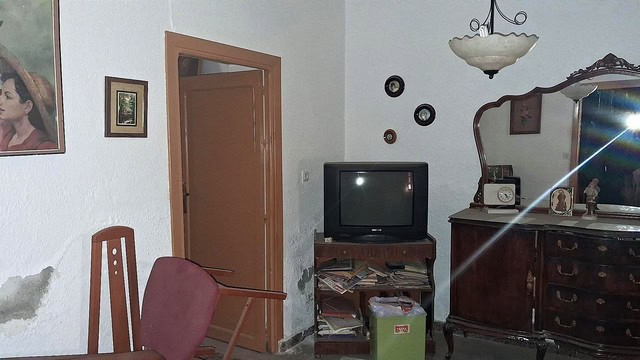 Cozy town house interior in Purchena, Almeria, featuring vintage furniture and traditional decor.