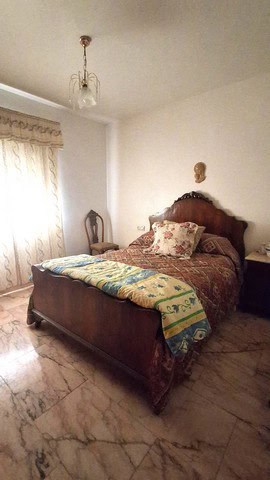 Cozy bedroom in a traditional town house located in Purchena, Almeria, featuring vintage furniture a.