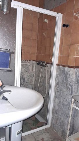 Compact shower enclosure in a town house bathroom, Purchena, Almeria.