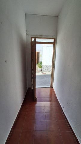 Entrance door to a village property in Armuna, Almeria, showcasing traditional Spanish architecture.