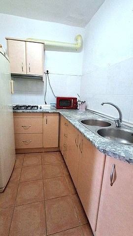 Cozy kitchen in a village property in Armuna, Almeria, featuring a compact layout with a sink, cabin.