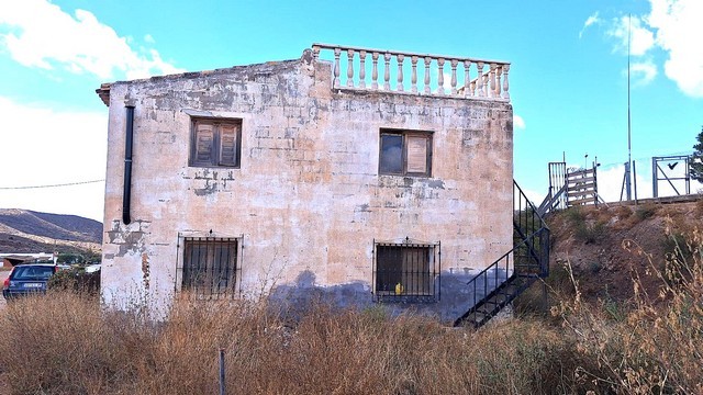 Rural property in Albox, Almeria featuring a rustic house with outdoor terrace and scenic countrysid.