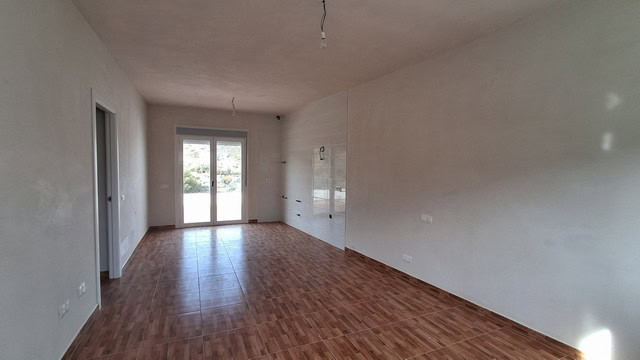 Rural property in Seron, Almeria with open-plan living space and large windows for natural light. Pe.