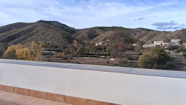 Scenic rural property view in Seron, Almeria with hills and traditional houses.