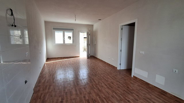 Interior view of a spacious rural property in Seron, Almeria, with natural light and wooden flooring.