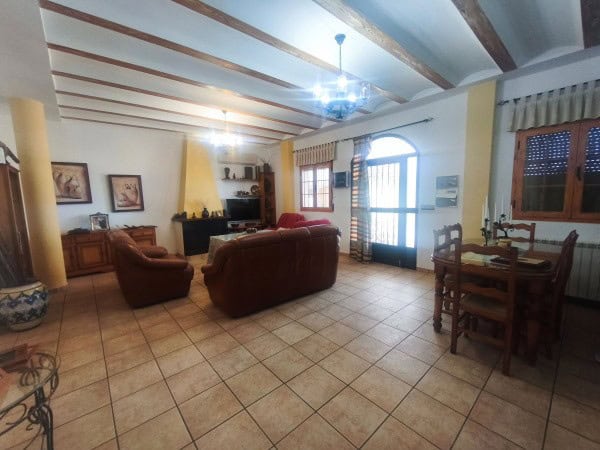 Spacious living room in rural property in Quesada, Jaen with traditional wooden beams and cozy furni.