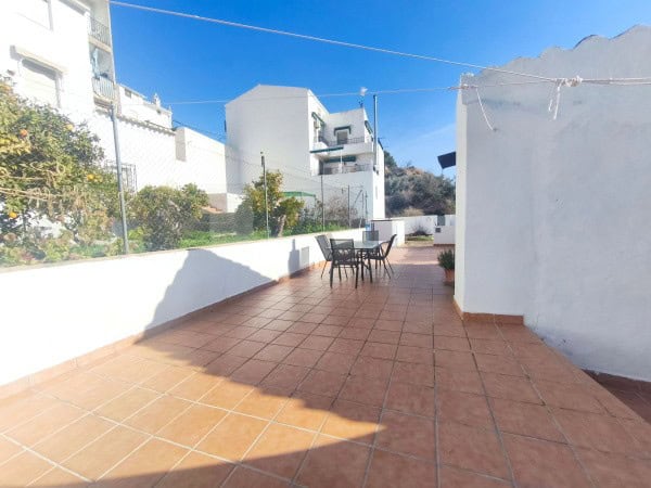 Spacious terrace of a village property in Hinojares, Jaen, with outdoor seating and scenic views.
