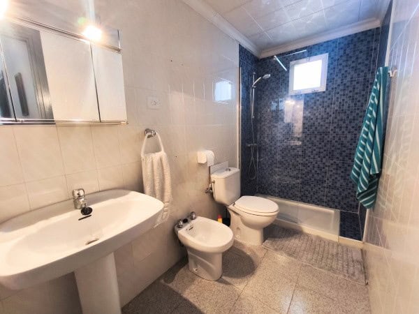 Bright bathroom with modern fixtures in a village property in Hinojares, Jaen. Features a shower, to.