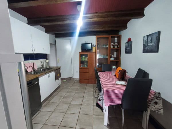 Charming rural property kitchen in Quesada, Jaen, featuring modern appliances and rustic decor. Perf.