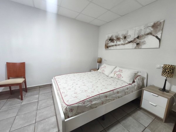 Charming bedroom in rural property in Quesada, Jaen, with modern decor and cozy atmosphere.
