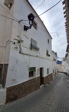 Village property in Urracal, Almeria with traditional whitewashed walls and narrow street views.