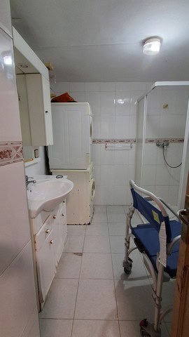 Cozy bathroom in a village property located in Urracal, Almeria, featuring essential fixtures and a.