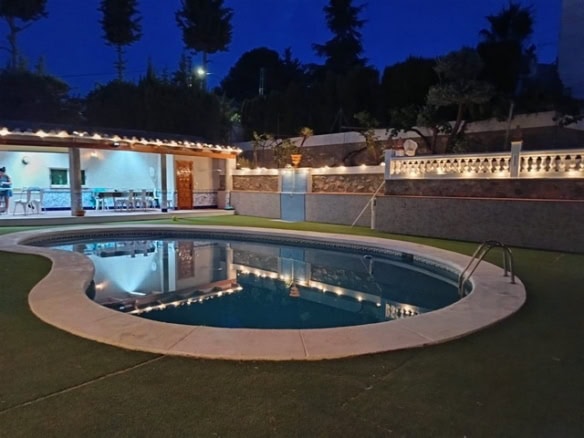 Beautiful night view of a private swimming pool in a villa in Cullar, Granada. Perfect for relaxing.