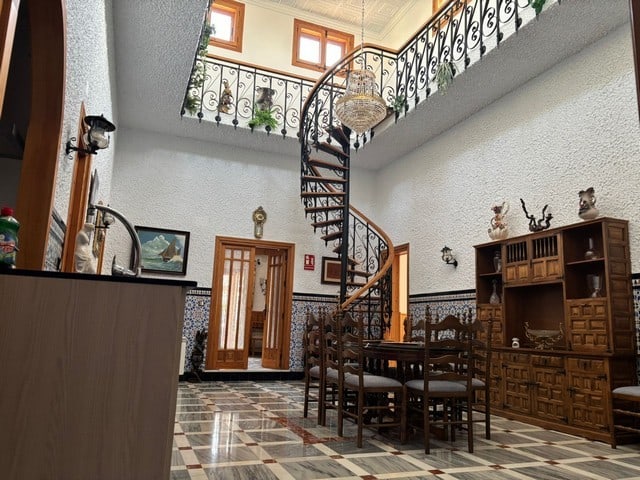 Charming villa in Cullar, Granada with elegant interior and spiral staircase. Perfect for a comforta.