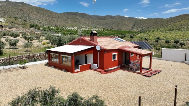 Villa in Uleila del Campo, Almeria with solar panels and spacious outdoor area.