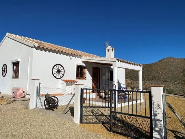 Charming white villa in Uleila del Campo, Almeria, with a spacious outdoor terrace and mountain view.