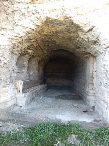 Cave house entrance in Benamaurel, Granada, showcasing traditional hillside dwelling.