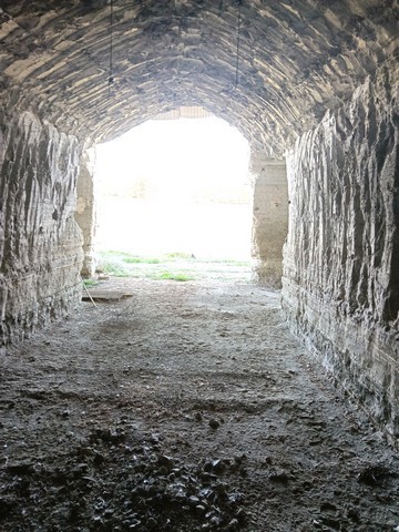 Cave house entrance in Benamaurel, Granada, showcasing traditional underground architecture.