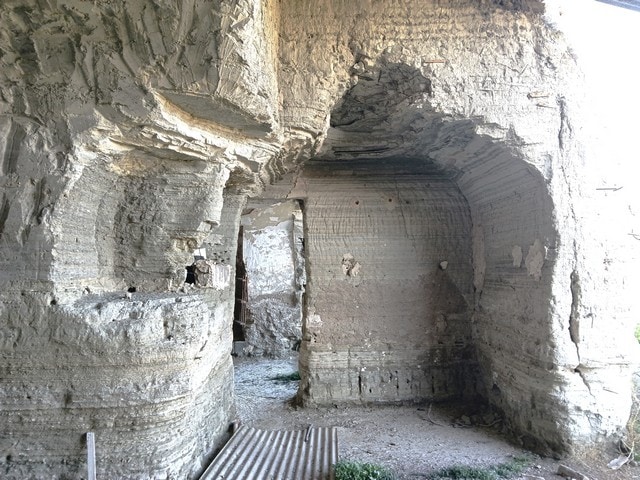 Cave house built into natural rock formations in Benamaurel, Granada, offering unique living experie.