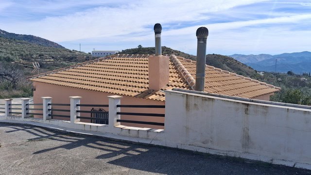 Villa in Urracal, Almeria with terracotta roof and scenic mountain views.