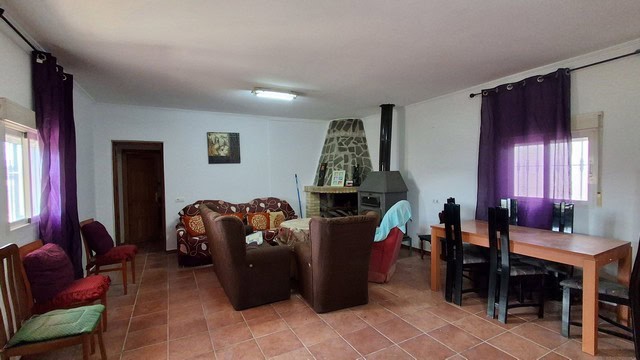 Cozy living room in a villa located in Urracal, Almeria, featuring comfortable seating and a traditi.