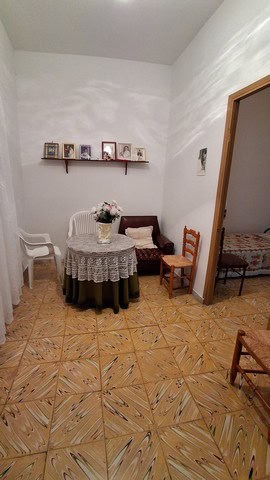 Charming town house interior in Seron, Almeria, featuring a cozy dining area with vintage furniture.