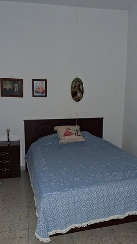 Comfortable bedroom with a double bed and traditional decor in Seron, Almeria.