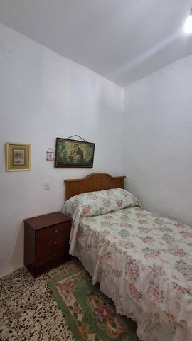 Charming bedroom in a town house in Seron, Almeria with simple decor and cozy atmosphere.