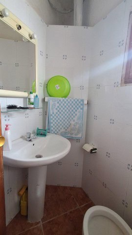 Small bathroom in town house, Seron, Almeria with sink and toilet.