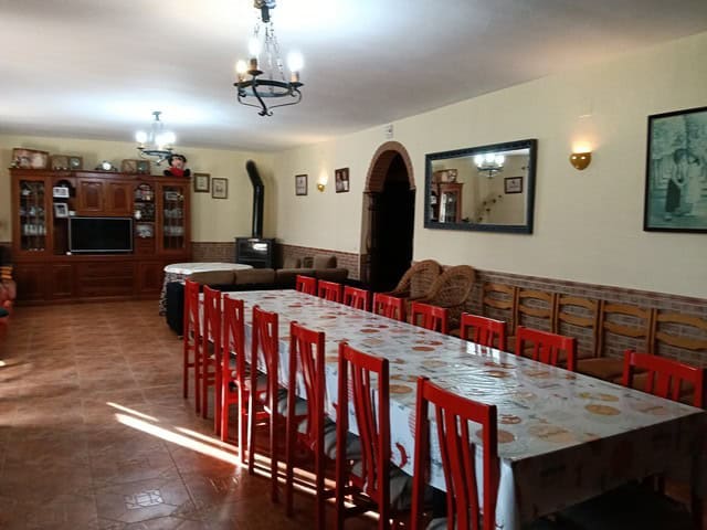 Charming rural property with spacious dining area in Benamaurel, Granada, ideal for family gathering.