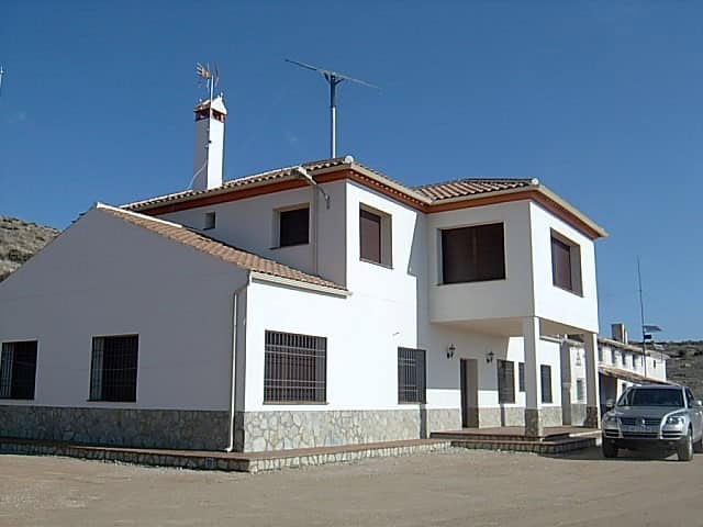Charming finca in Huescar, Granada, featuring traditional architecture and scenic mountain views.