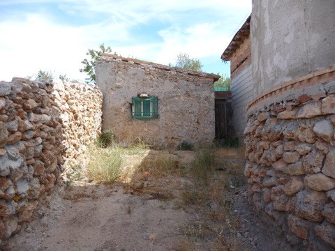 Charming village property in Pozo Alcon, Jaen, with rustic stone walls and traditional architecture.