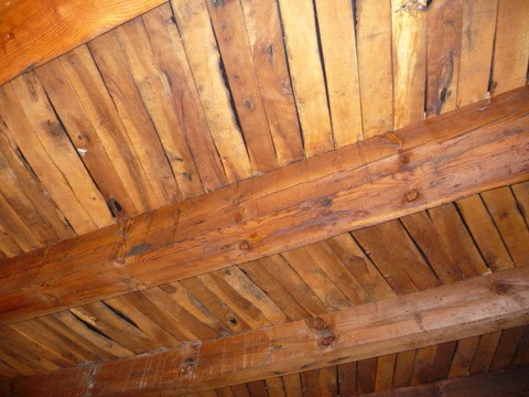 Wooden ceiling beams in a traditional village property in Pozo Alcon, Jaen, Spain.