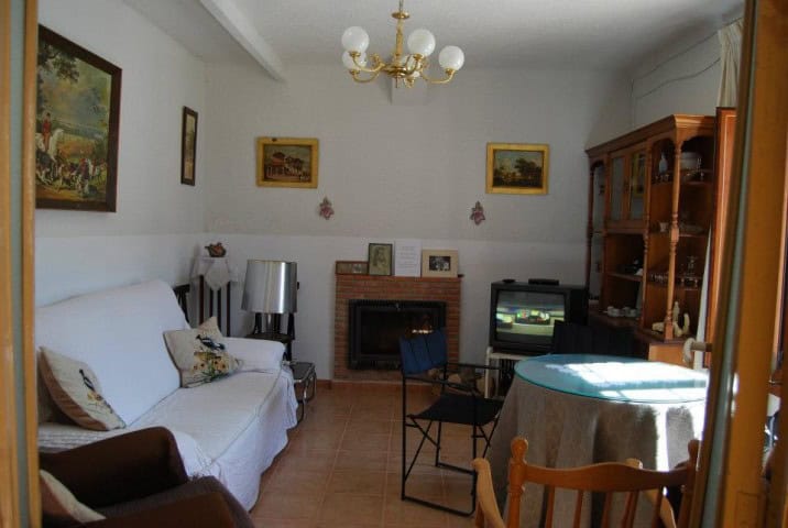 Charming village property interior in Cuevas del Campo, Granada, featuring a cozy living room with t.