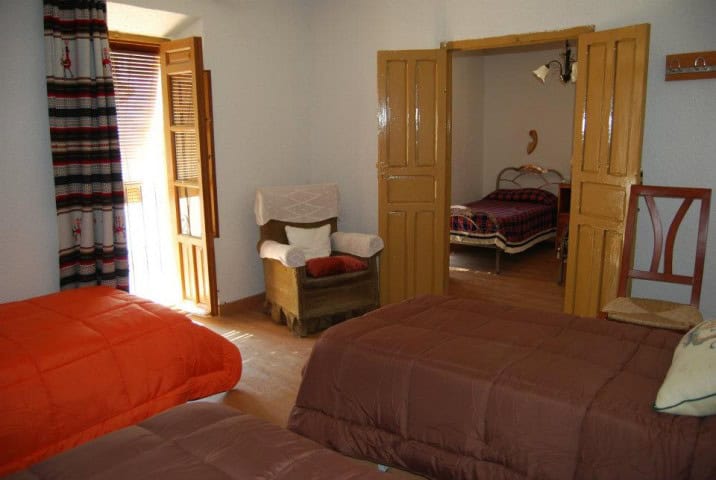 Cozy village home with multiple bedrooms in Cuevas del Campo, Granada, ideal for relaxing stays.