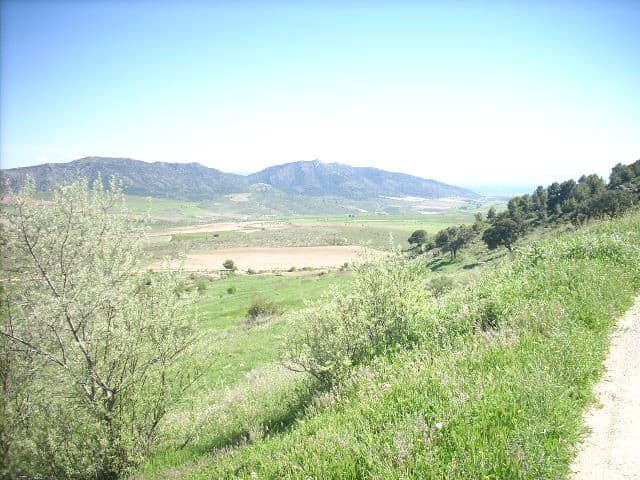 Finca in Huescar, Granada with scenic views of mountains and lush greenery. Perfect for countryside.