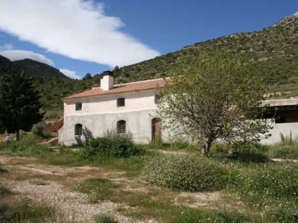 Finca in Huescar with traditional architecture and scenic mountain views in Granada, Spain.