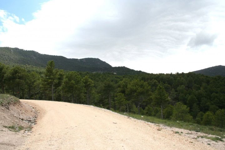 Finca with dirt road and mountain views in Huescar, Granada, Spain.