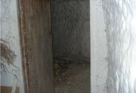 Cave house entrance in Orce, Granada, showcasing traditional underground architecture.