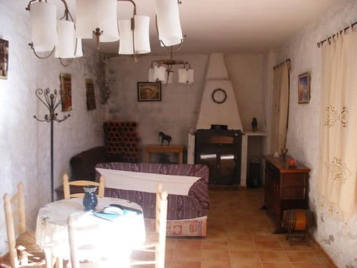 Cozy interior of a traditional village property in Gorafe, Granada, featuring rustic decor and authe.