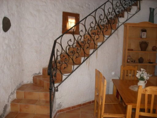 Cozy interior of a village property in Gorafe, Granada, featuring rustic decor and traditional archi.