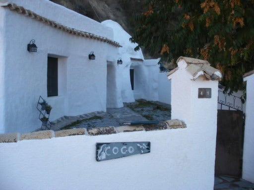 Charming white cave house in Cortes de Baza, Granada, with traditional architecture and scenic surro.