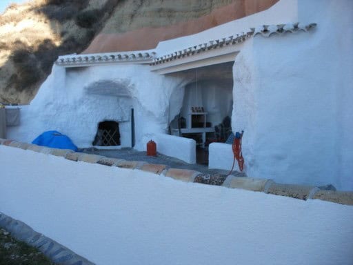 Cave house in Cortes de Baza, Granada with traditional whitewashed walls and unique architecture.