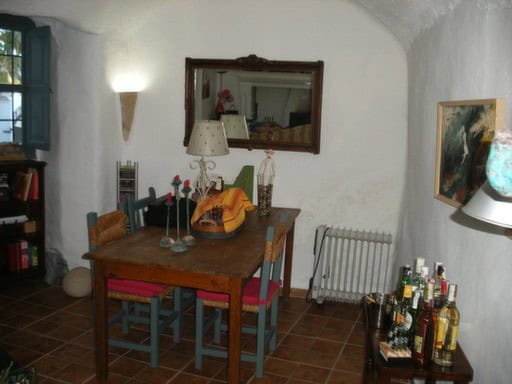 Cave house interior with rustic furniture and colorful accents in Cortes de Baza, Granada. Perfect f.