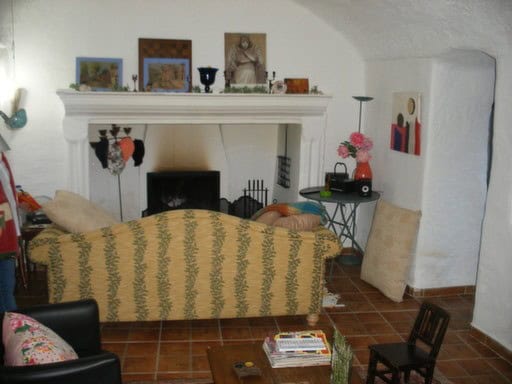 Cave house in Cortes de Baza, Granada with rustic decor and comfortable furnishings.